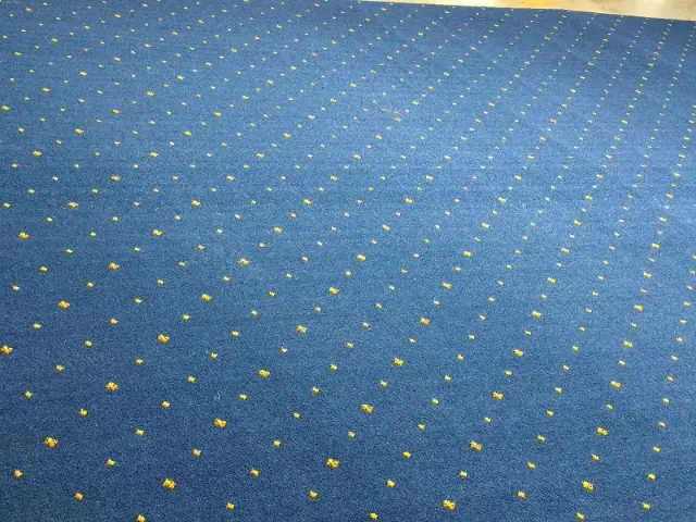 High-density weaving process for durable aviation-grade wool carpets